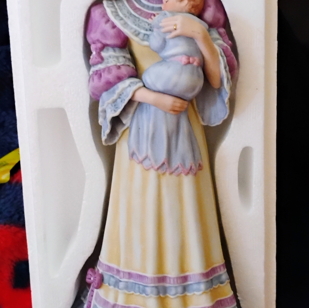 Cherished memories woman holding baby porcelain doll